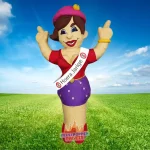 Opblaasbare Sarah-pop met sjerp “Hoera Jarige” en bordje 60, lachend met armen omhoog.